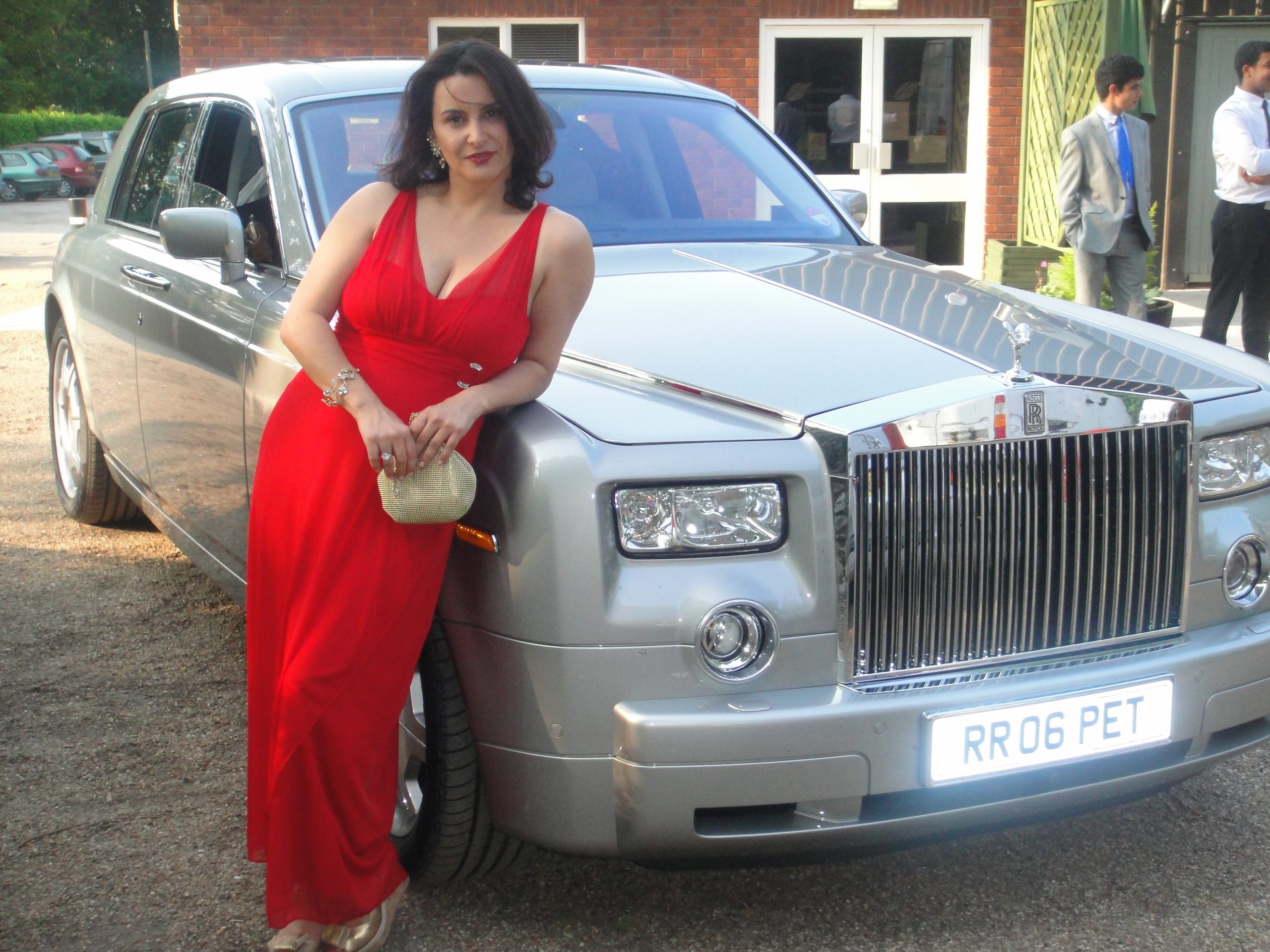 Genealogist Poses with Phantom Rolls Royce