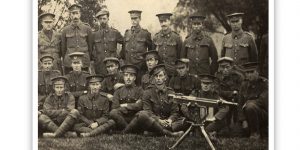 Black and white image of servicemen posing for a photo