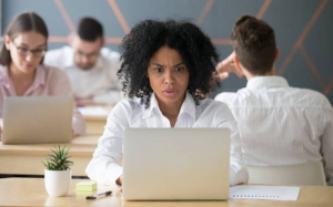 Woman shocked at laptop screen