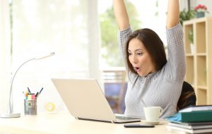 A woman celebrating after solving probate puzzles